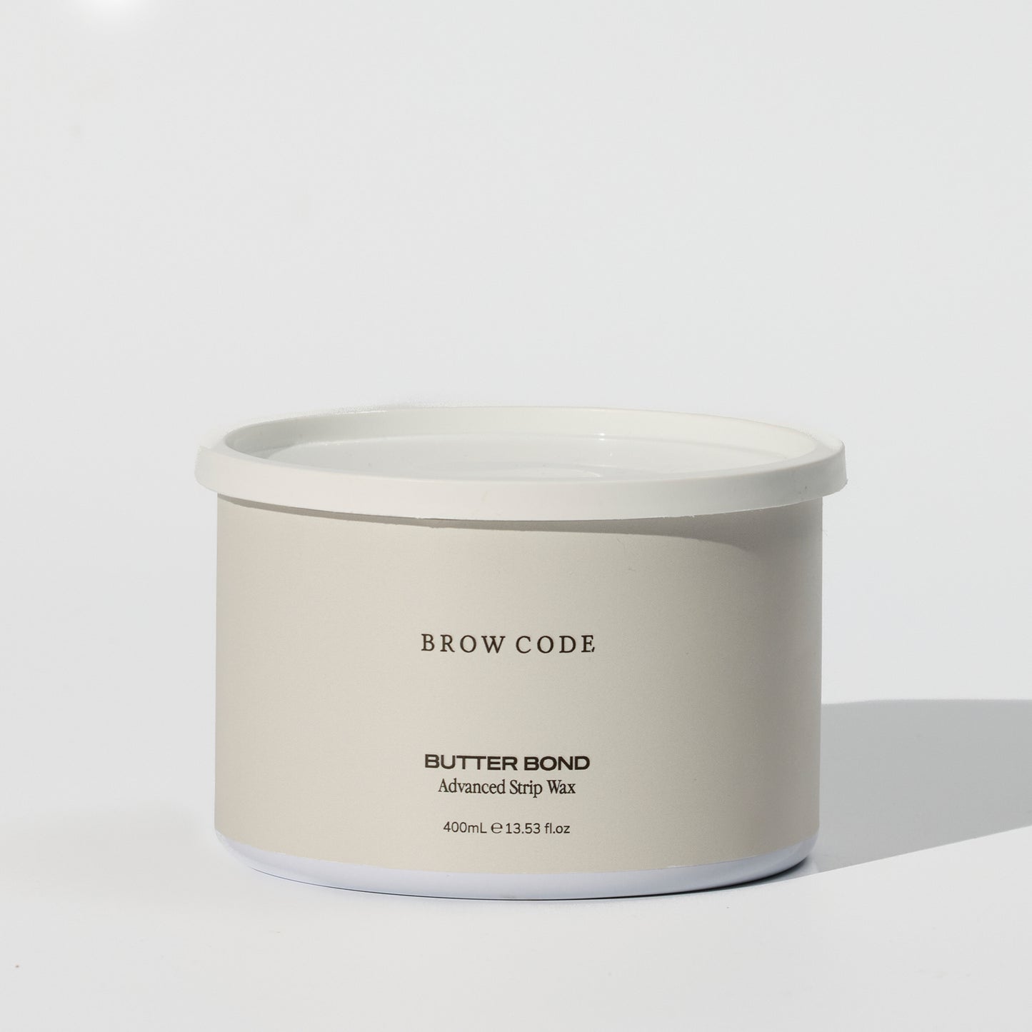 Brow Code Butter Bond on a cream background