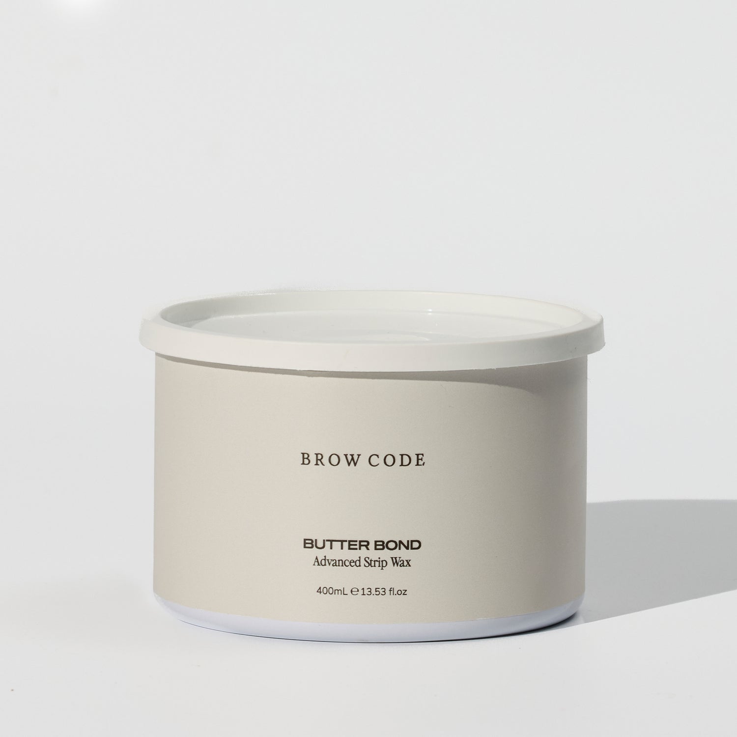 Brow Code Butter Bond on a cream background