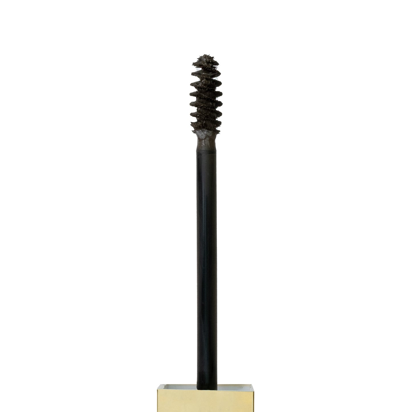 Close up shot of spoolie with Tinted Multi-Peptide Brow Gel - color-dark-brown